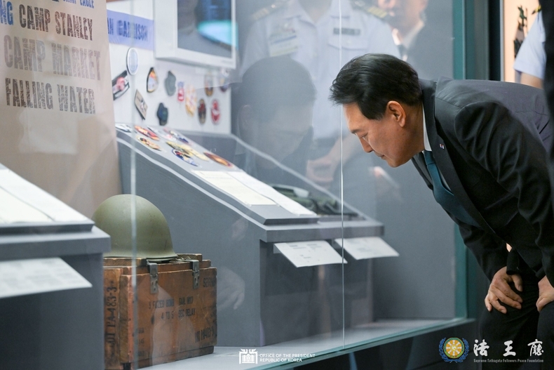 President Yoon Suk-yeol on June 25 looks around an exhibition at the National Museum of Korean Contemporary History in Seoul commemorating the 70th anniversary of the nation's bilateral alliance with the U.S.